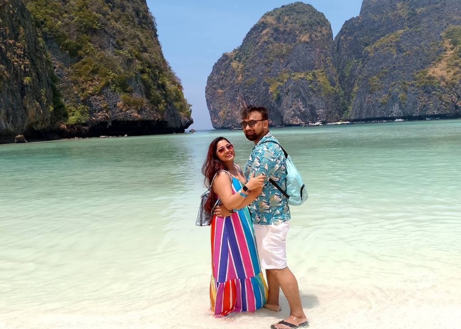 Couple standing in the shallow water of Maya Bay